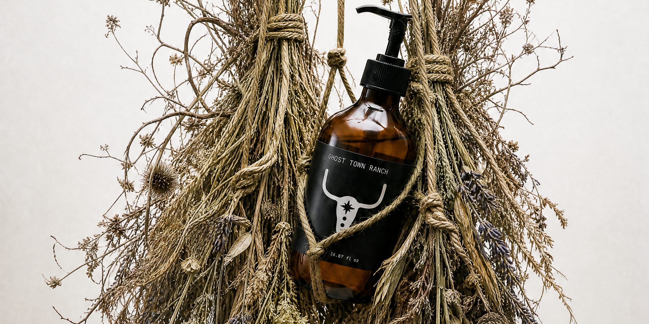 Ghost Town Ranch — amber glass bottle cradled in hang-dried desert botanicals, Twentynine Palms California