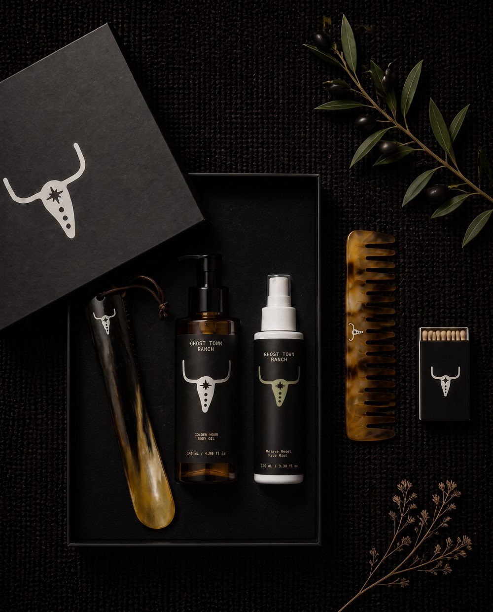Horn shoehorn, horn comb, Golden Hour body oil and Mojave Reset face mist in a black Bull box