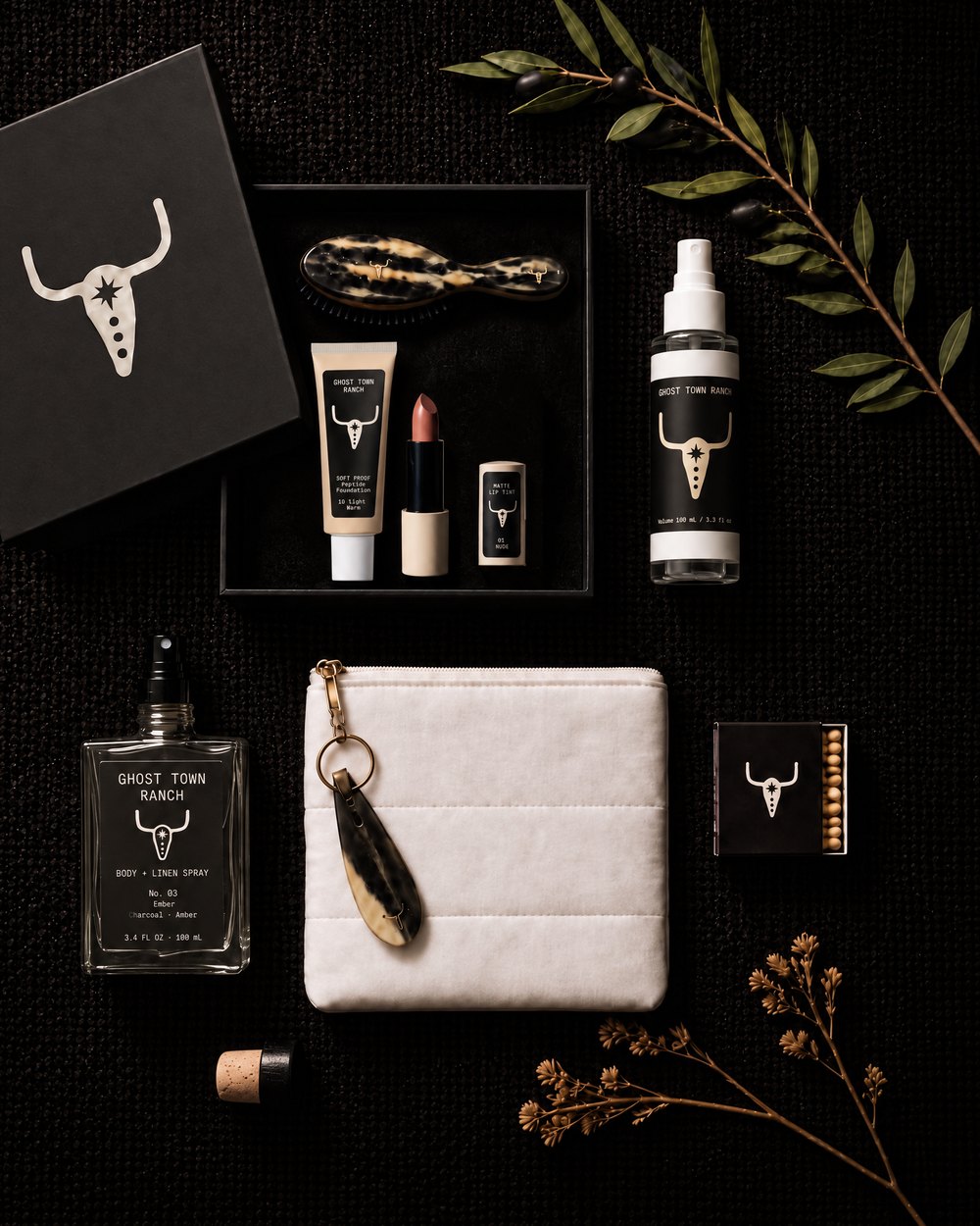 White Day Ride bag with the horn shoehorn keyring, horn hairbrush, Soft Proof foundation, Drawn Line in 01 Nude, Dry Creek and Ranch Water